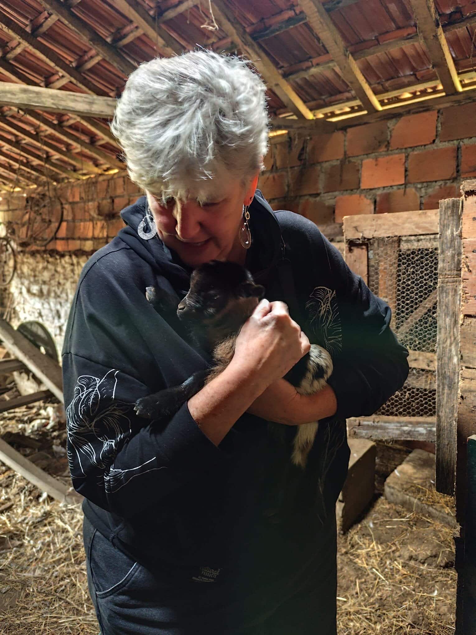 Holding a 2-day old goat