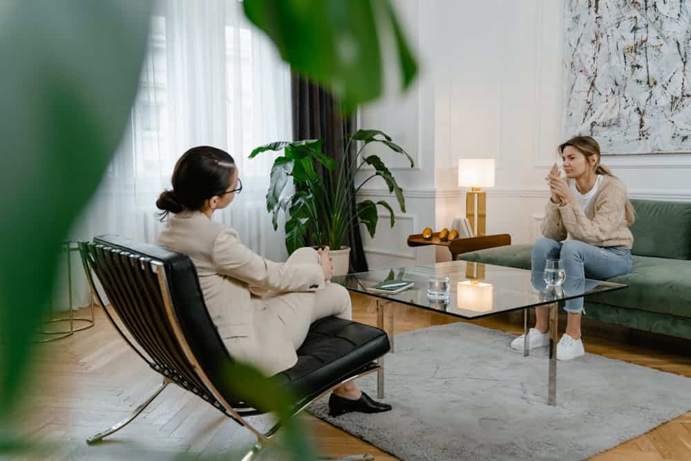 Practitioner speaking with a female client